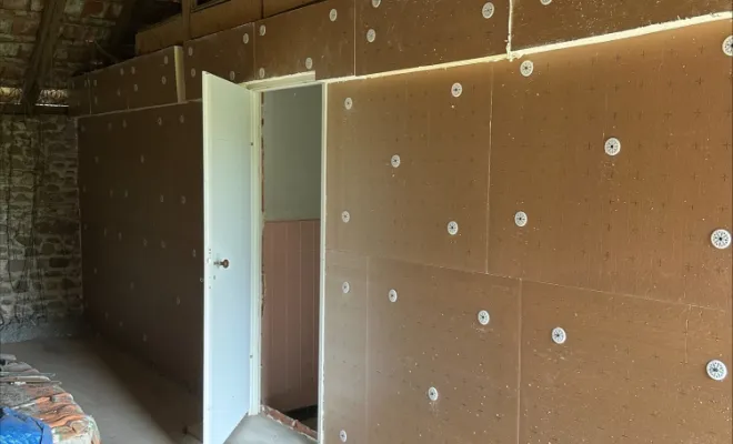 Isolation du mur par panneau de Knauf Thane Mur